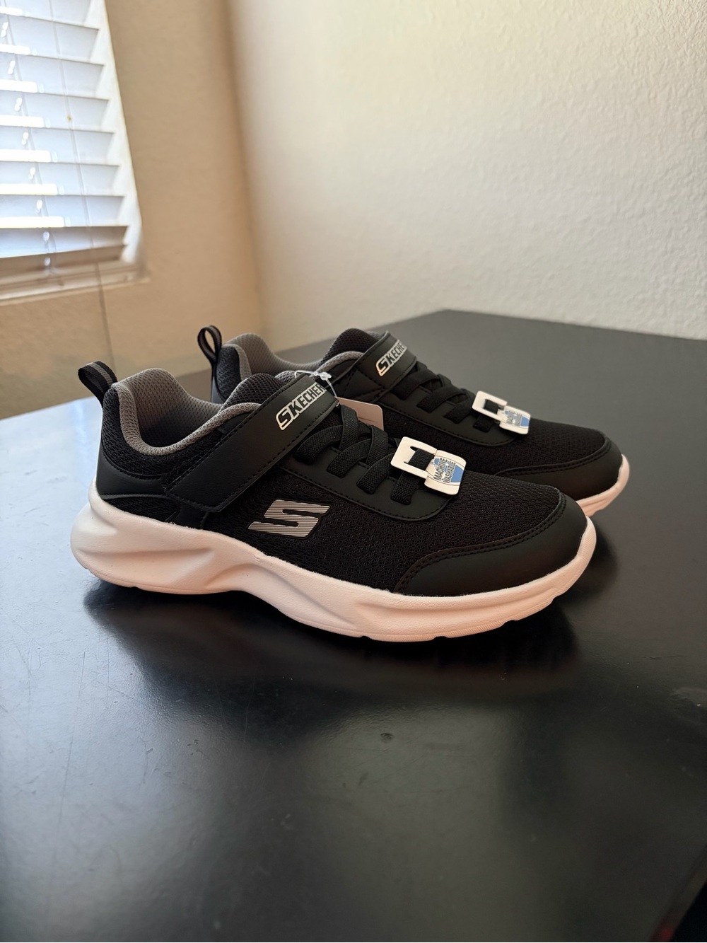 Skechers Kids Black and White Slip-On Athletic Sneakers